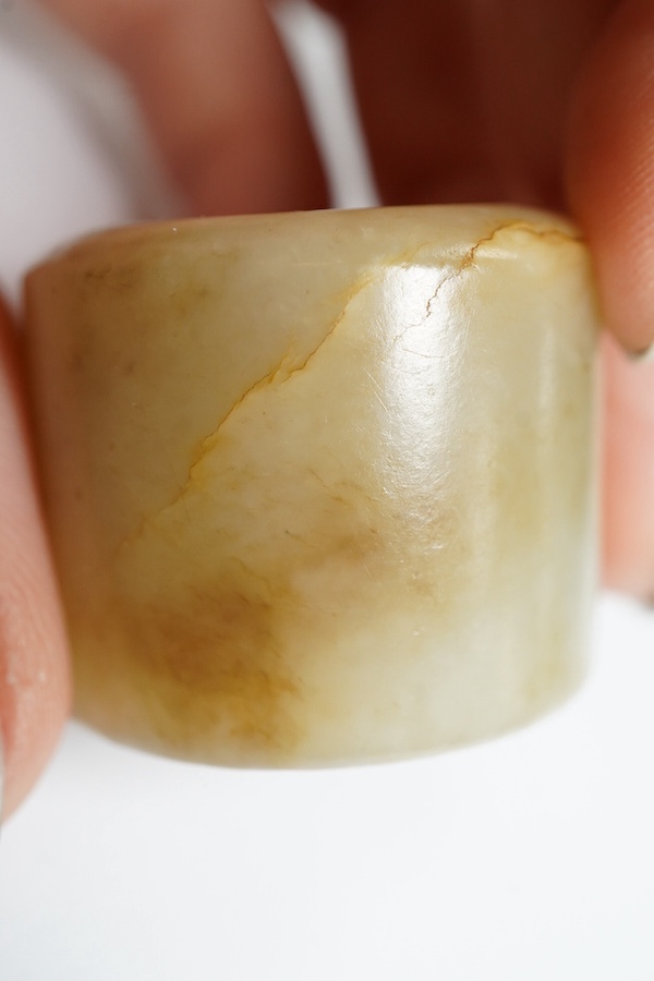 A Chinese pale celadon jade archer's thumb ring, 18th/19th century